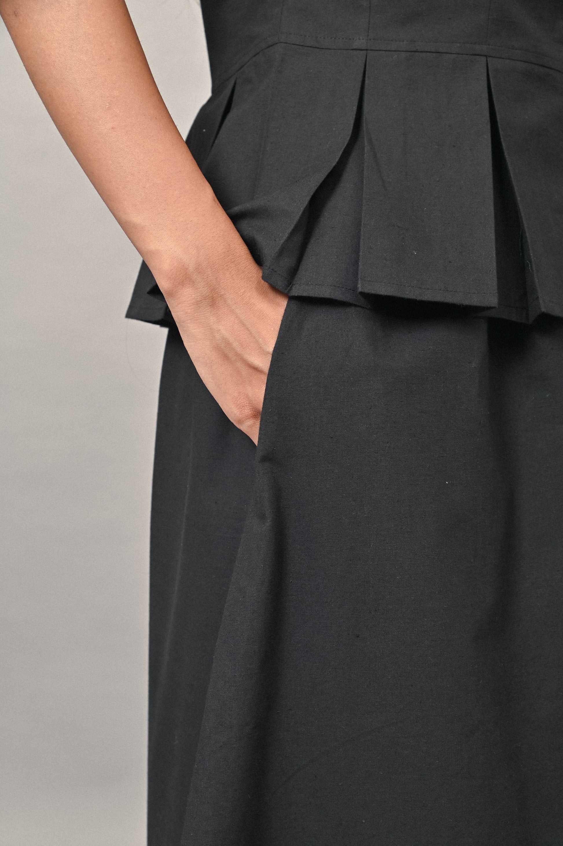 Black cotton skirt with side pocket detail